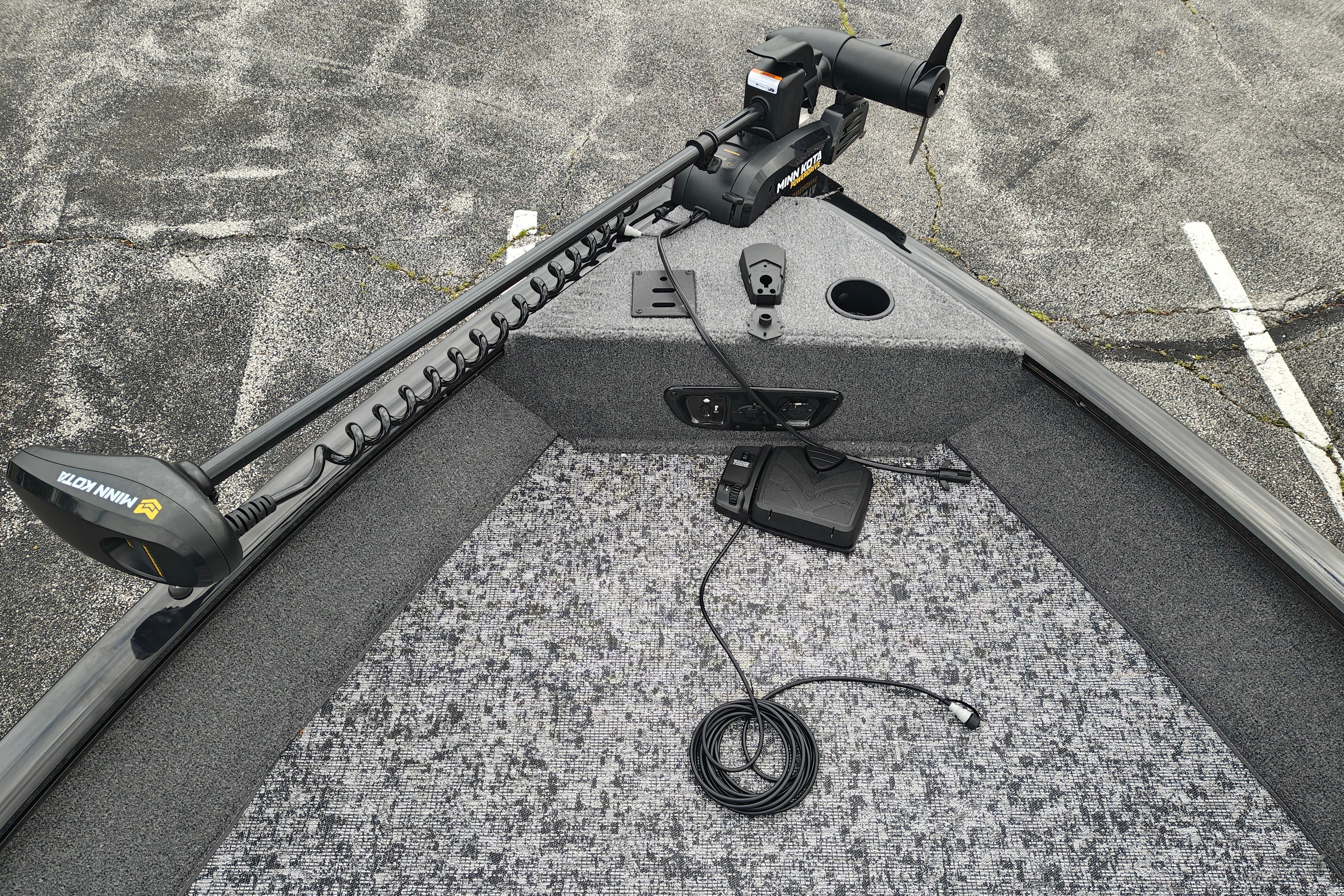 2026 Tracker Pro Guide V-175 WT boat with Minn Kota trolling motor on carpeted deck.
