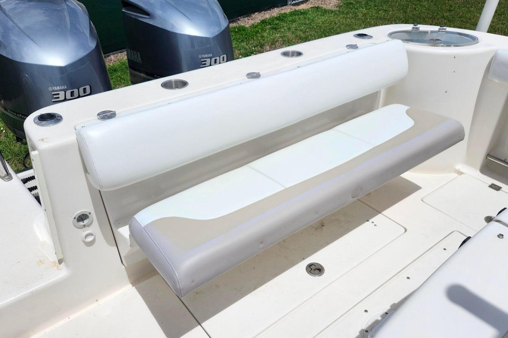 2015 Robalo R300 Center Console boat with Yamaha 300 engines and cushioned seating.