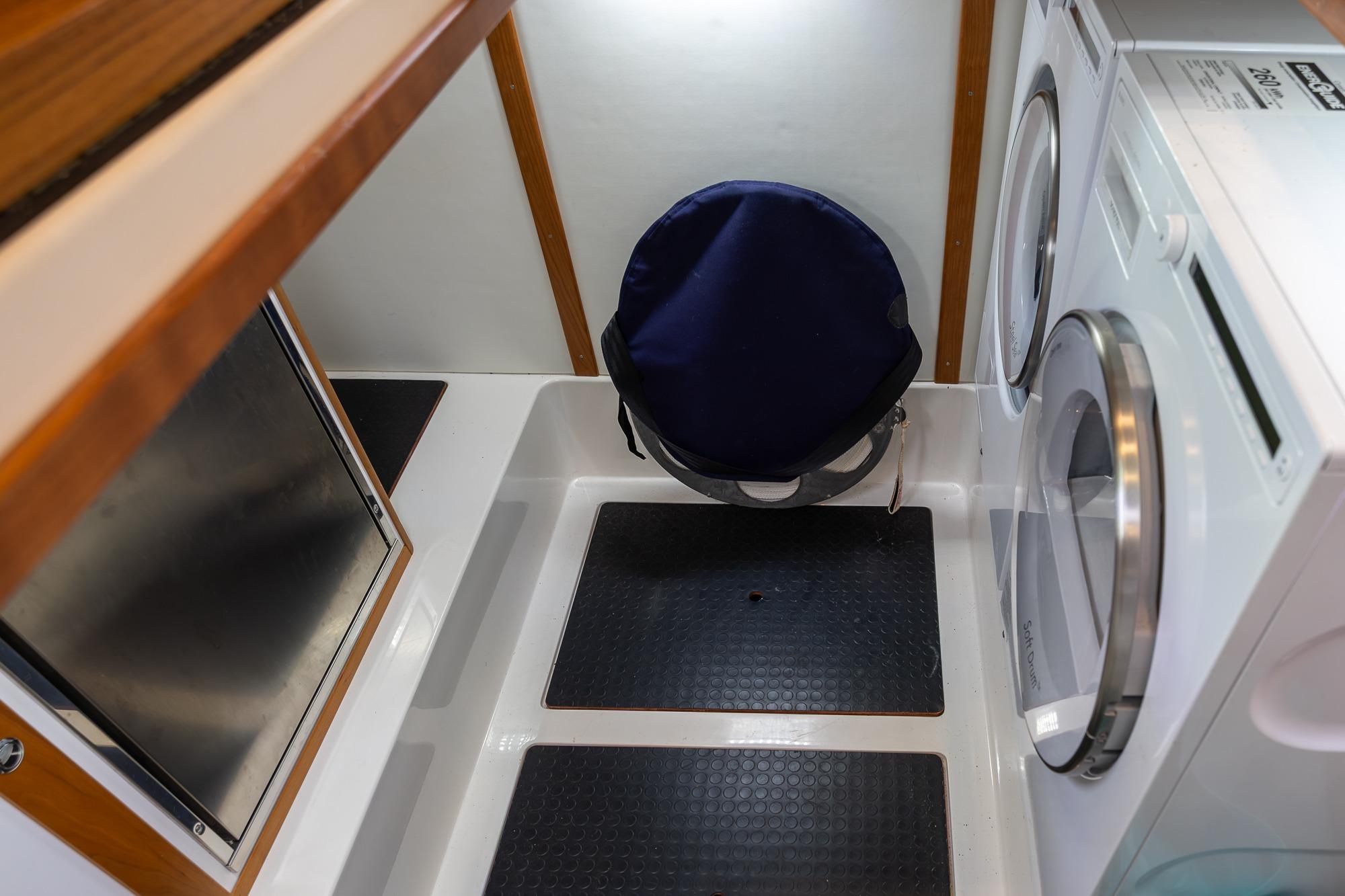 Laundry area in 2023 Sabre 45 Salon Express yacht with washer and dryer.