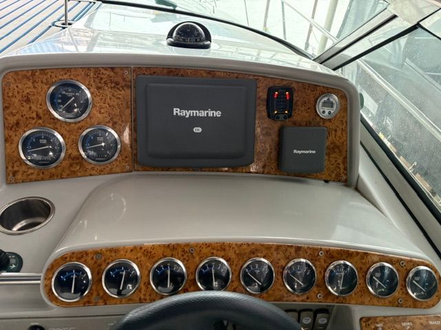 Dashboard of a 2007 Formula 34 Performance Cruiser with Raymarine display and wood accents.