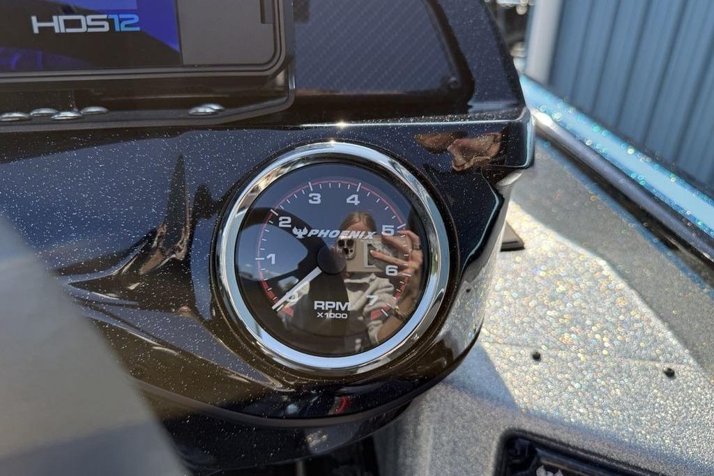 Close-up of 2026 Phoenix 20 XE RPM gauge on a boat dashboard.