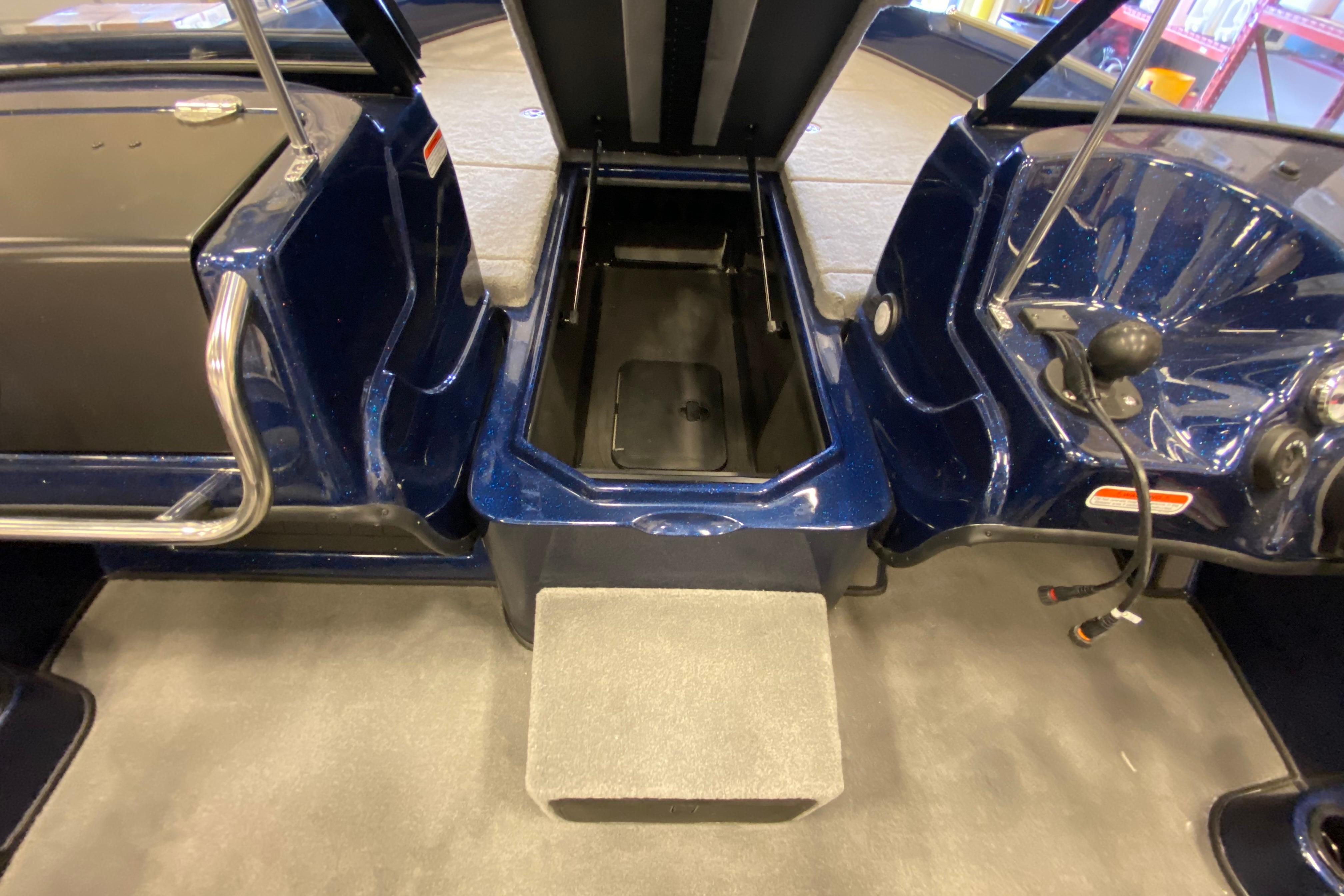 Interior view of 2026 Nitro ZV19 Pro boat, featuring storage compartment and seating area.