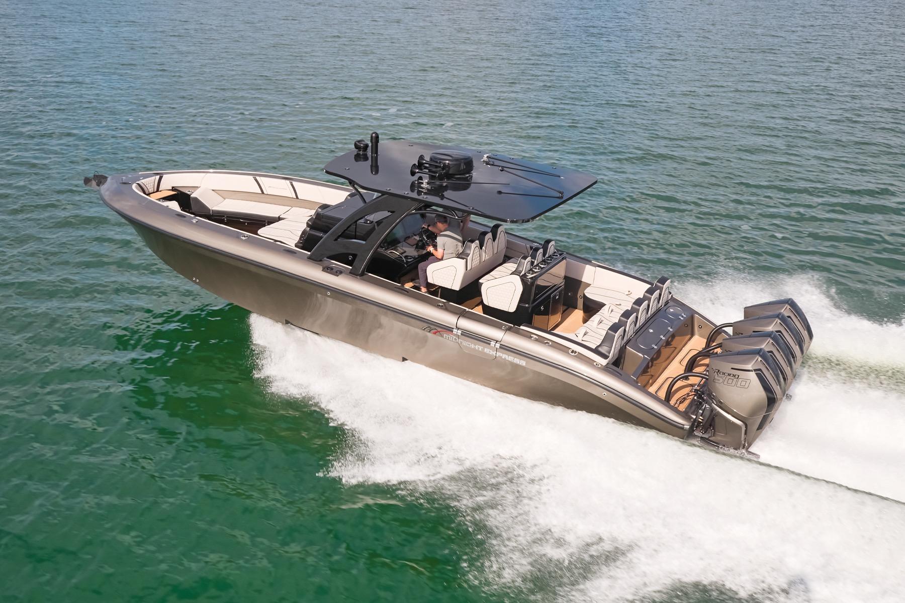 2025 Midnight Express 37 Open boat cruising on clear water with powerful engines.
