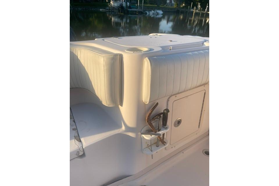 2002 Grady-White Marlin 300 boat interior with cushioned seating and storage compartment.