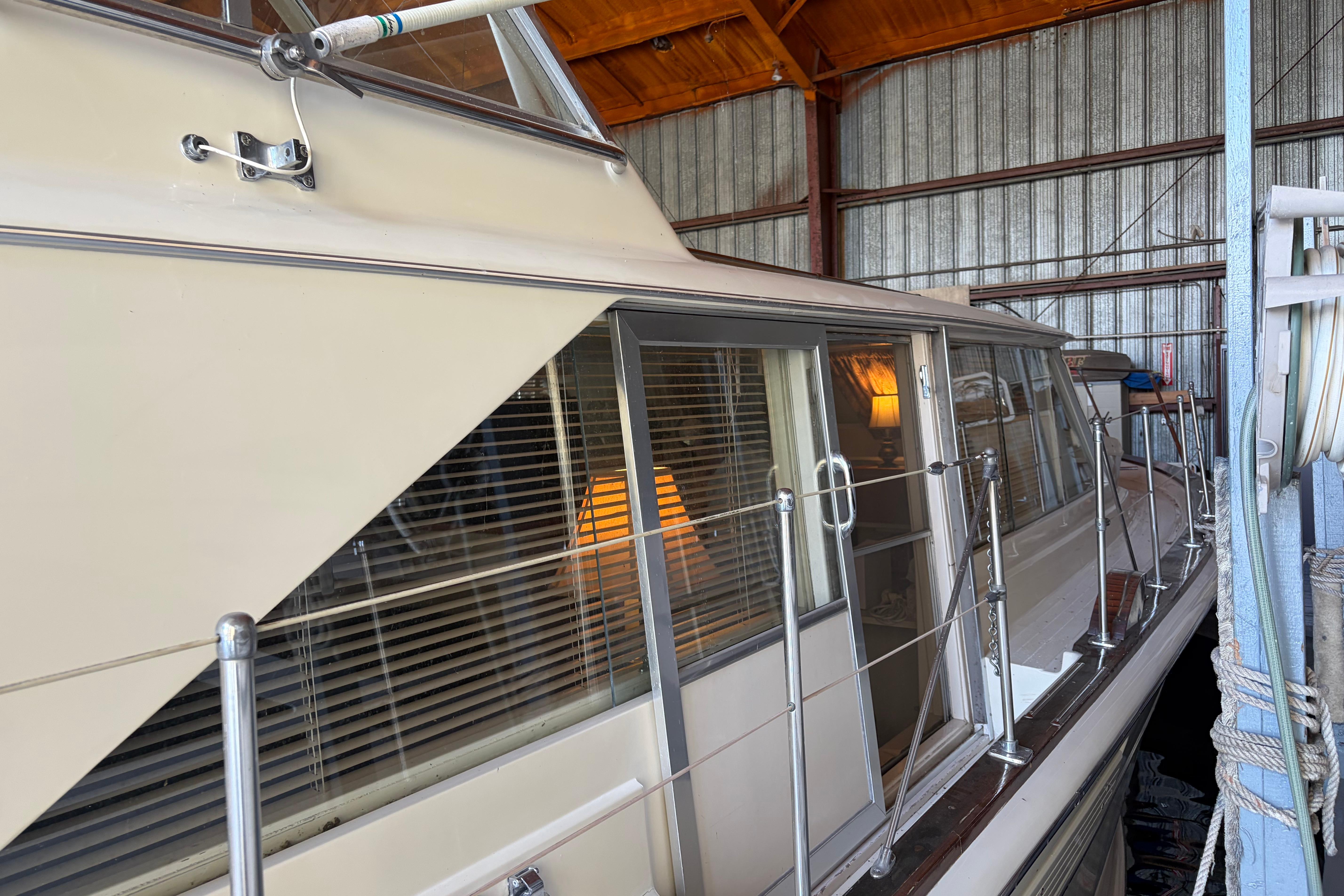 1971 Chris-Craft 42 Commander yacht docked in a covered marina.