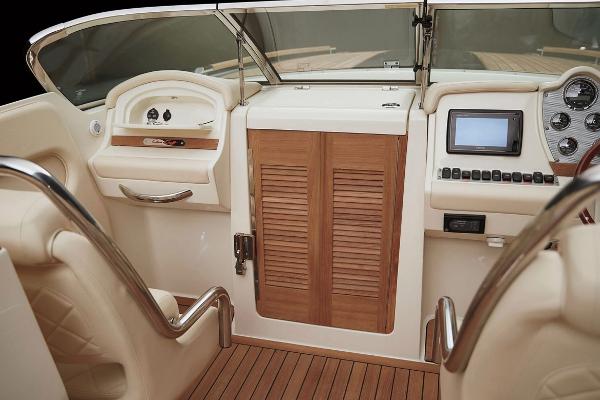 Interior of a 2021 Chris-Craft Corsair 34 boat with wood paneling.