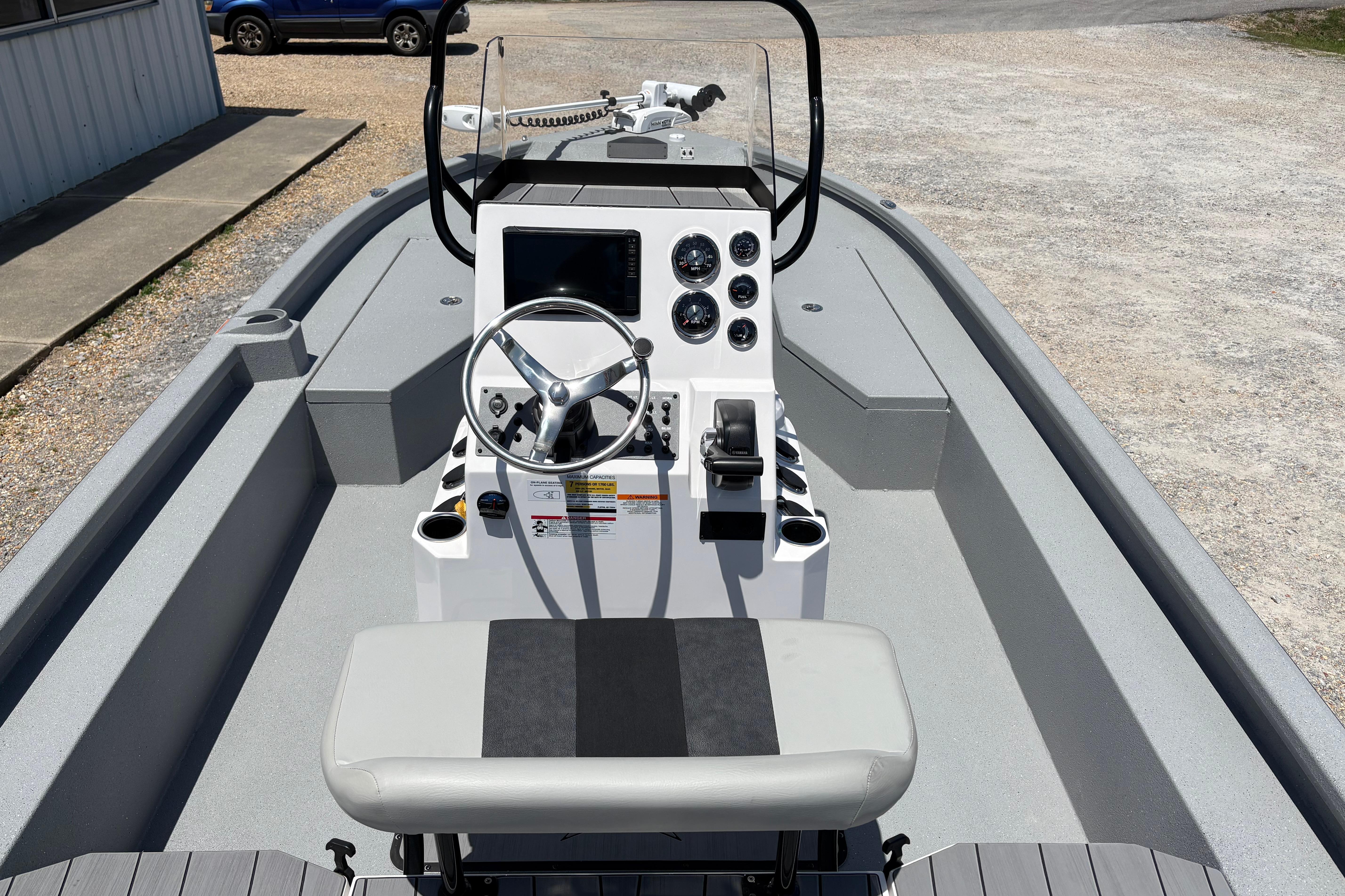 2026 Vexus ACX 2150 boat interior with steering console and seating.