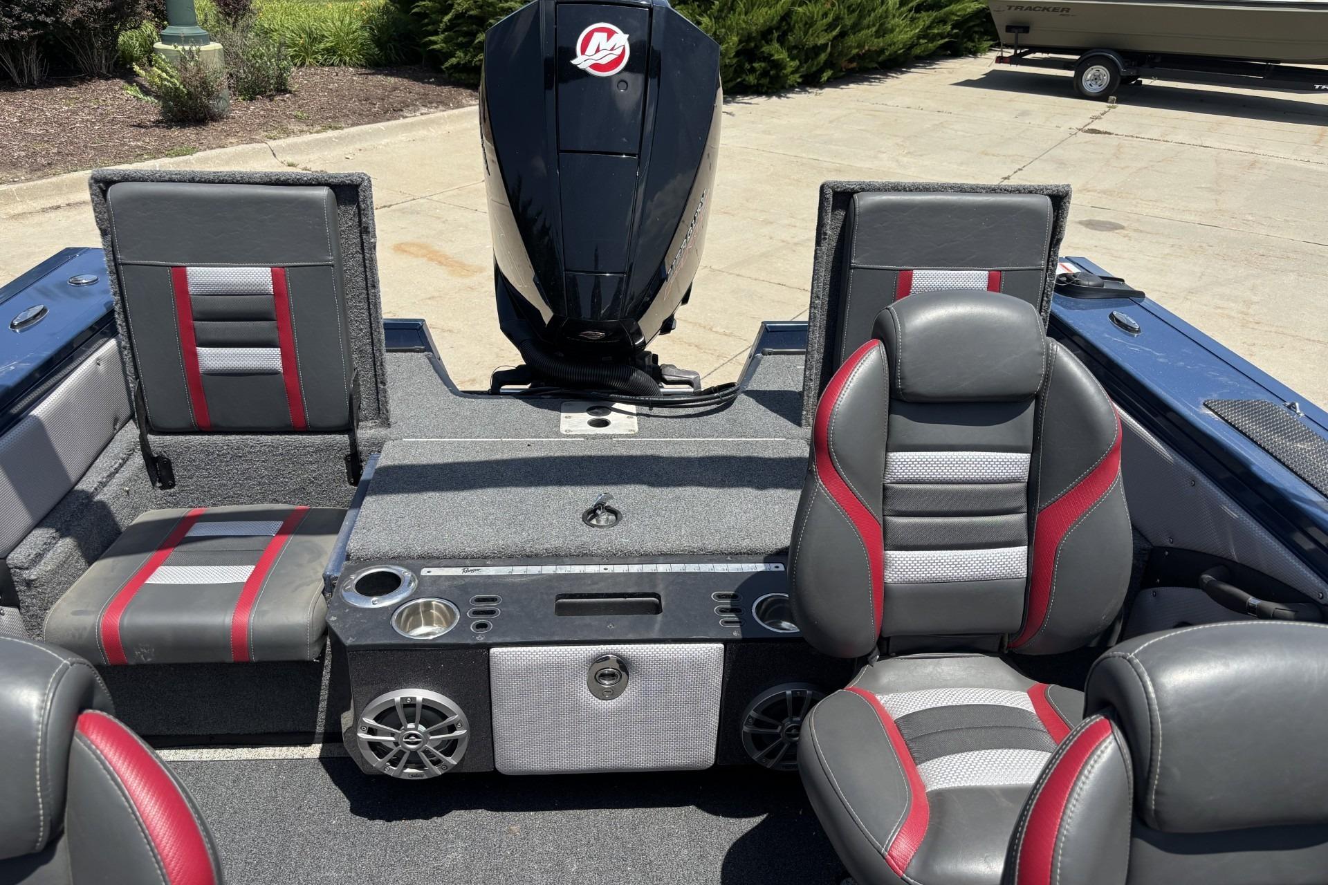2021 Ranger VX1788 WT boat interior with gray and red seating, motor, and console.