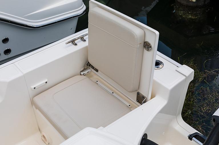Manufacturer Provided Image: 2026 Boston Whaler 210 Montauk boat seat detail, featuring beige upholstery and sleek design.