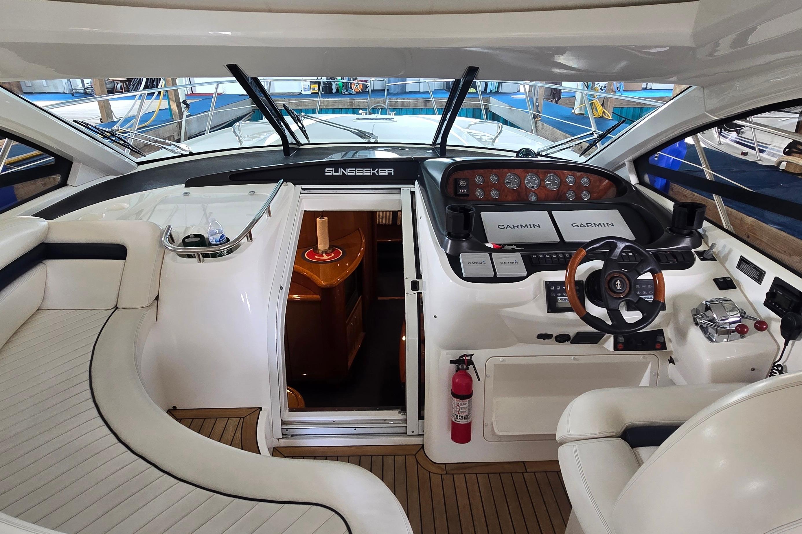Interior of 2004 Sunseeker Camargue 50 yacht with modern helm and seating area.