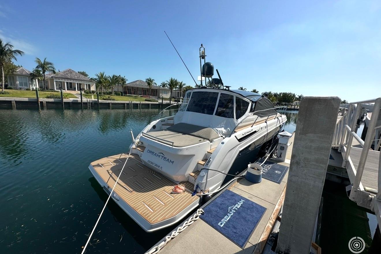 2021 Azimut Atlantis 45 yacht docked in a serene marina setting.
