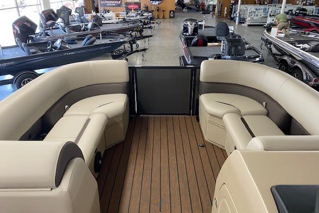2026 Bentley Pontoons Legacy 223 Swingback interior with luxurious seating and wood-style flooring.