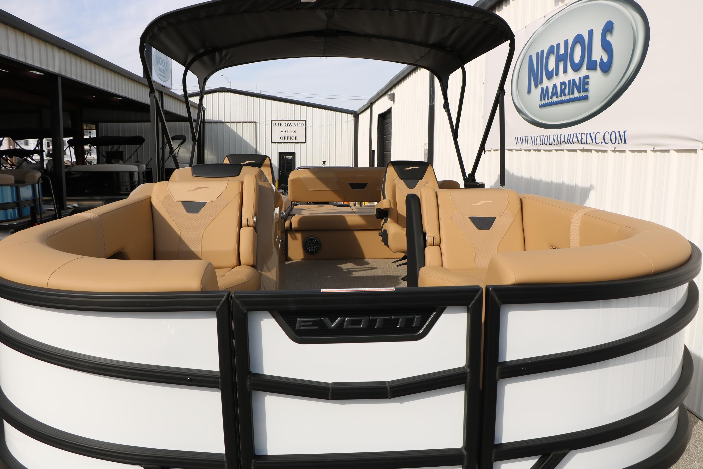 2026 Evotti 523CS pontoon boat with tan seating at Nichols Marine dealership.