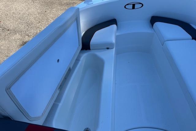 2026 Tahoe T16 boat interior with open storage compartment and seating.