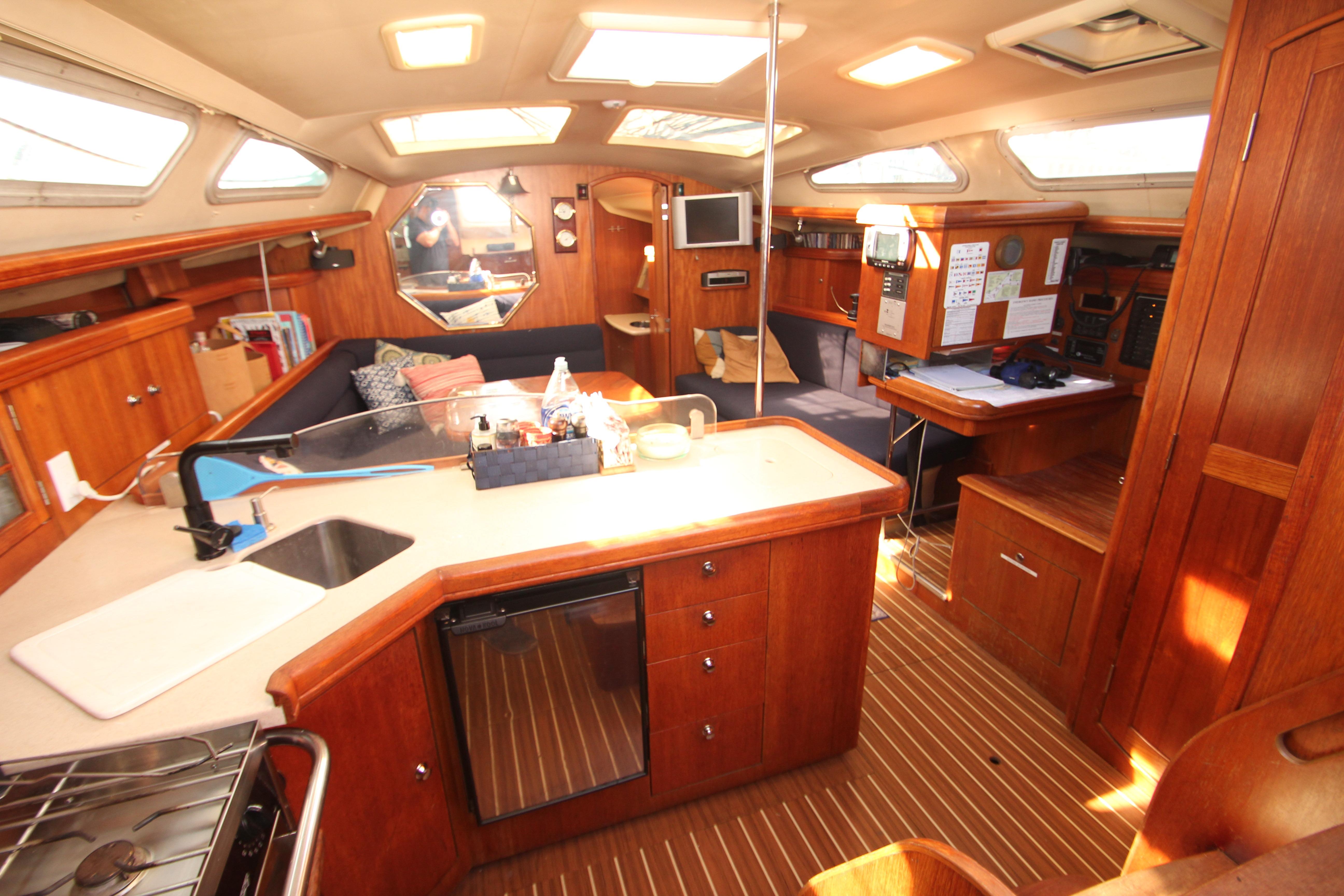 Interior of 2005 Hunter 41 AC sailboat with wood finish and modern amenities.