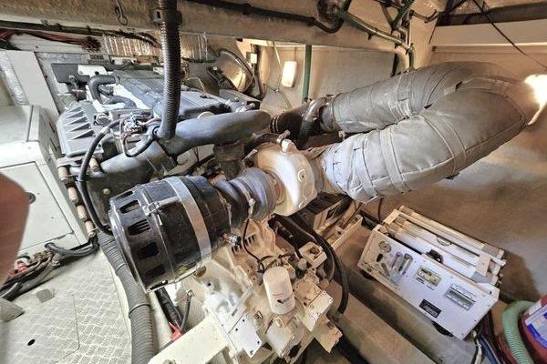 Engine room of a 2005 Sunseeker Manhattan 66 yacht, showcasing mechanical components.