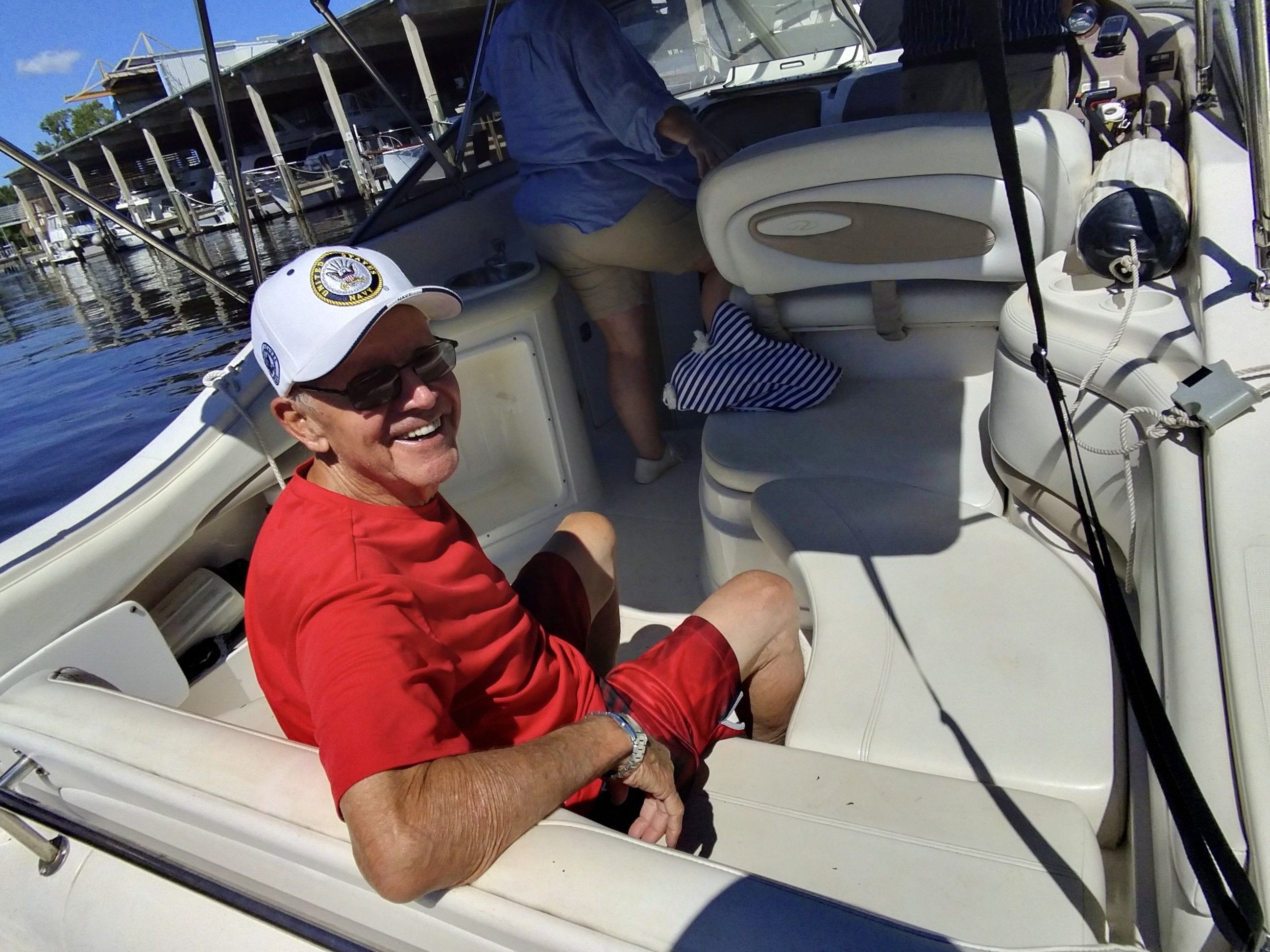 Man in red shirt on Regal Commodore 2465 boat, 2004.