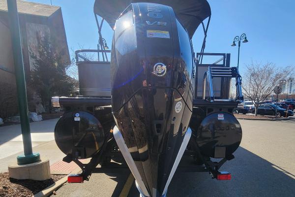 2024 Regency 250 DL3 pontoon boat with powerful V8 engine, rear view.