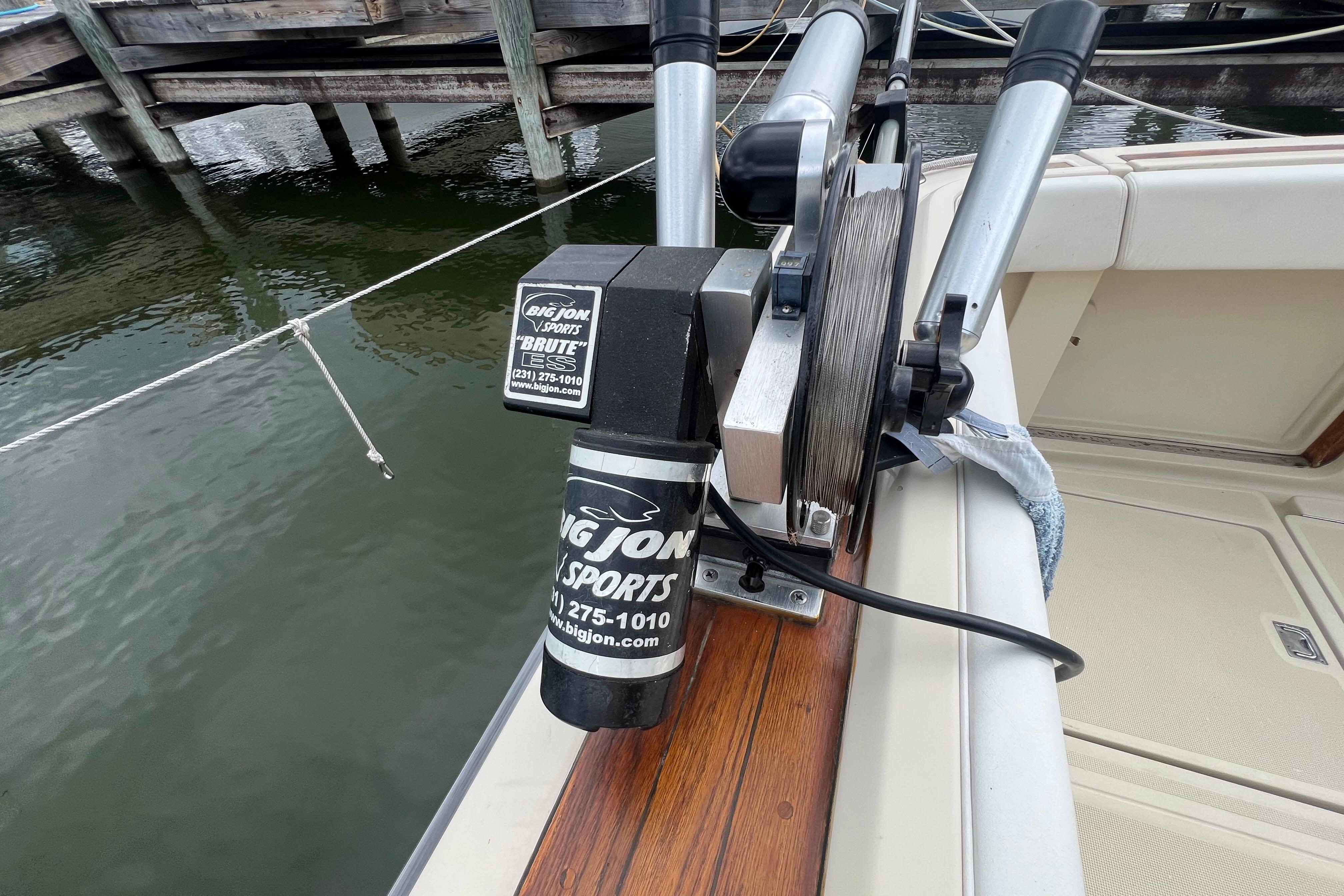 Fishing equipment on 1985 Tiara 36 OPEN boat, featuring Big Jon Sports downrigger.