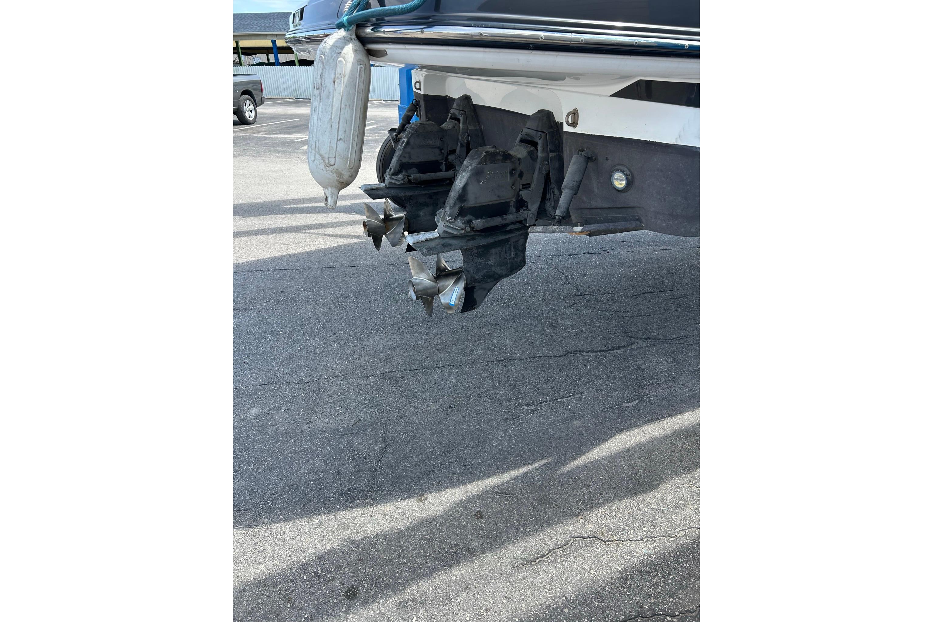 2019 Monterey 335 Sport Yacht propellers and stern drive in a parking lot.
