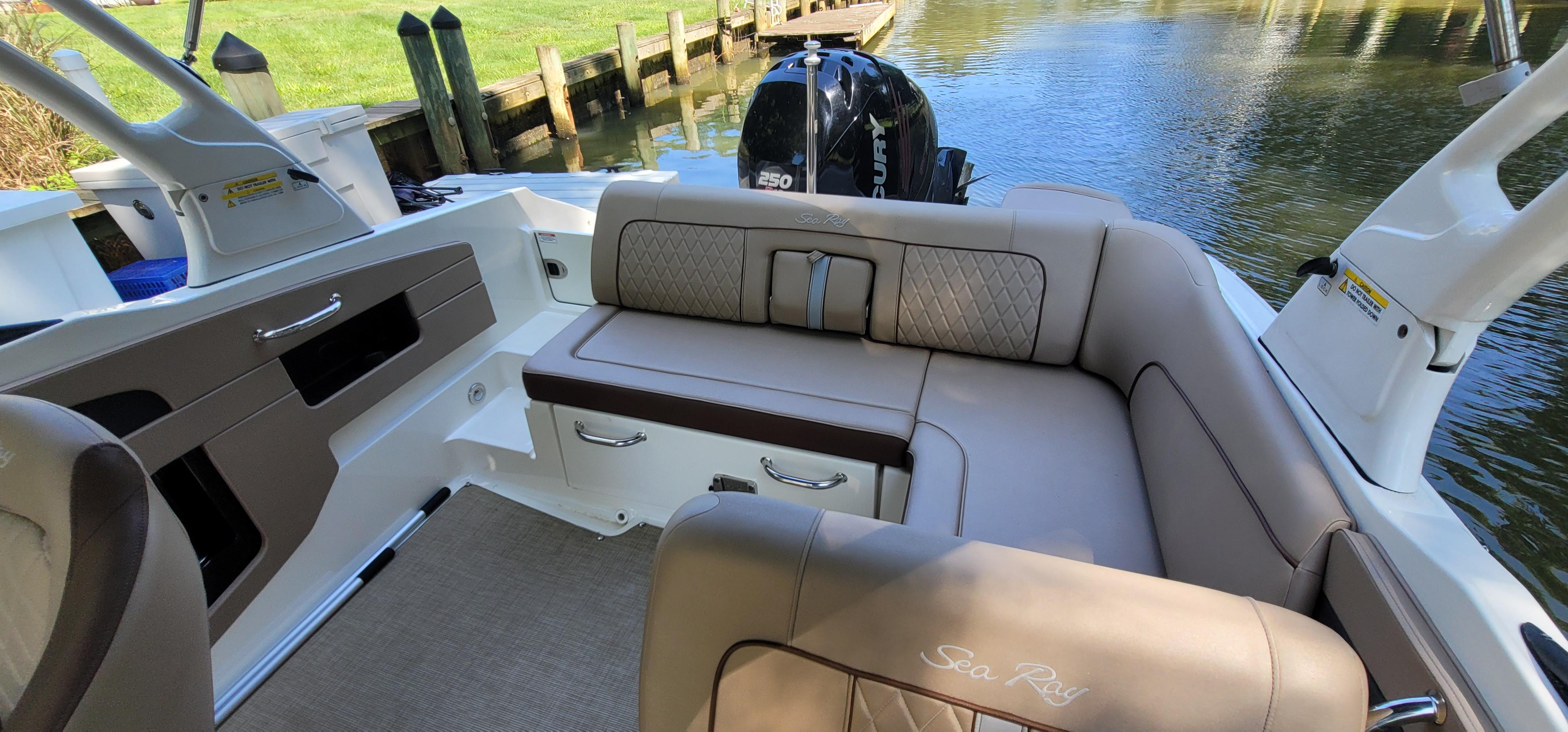 2017 Sea Ray SDX 240 Outboard boat interior with luxurious seating and water view.