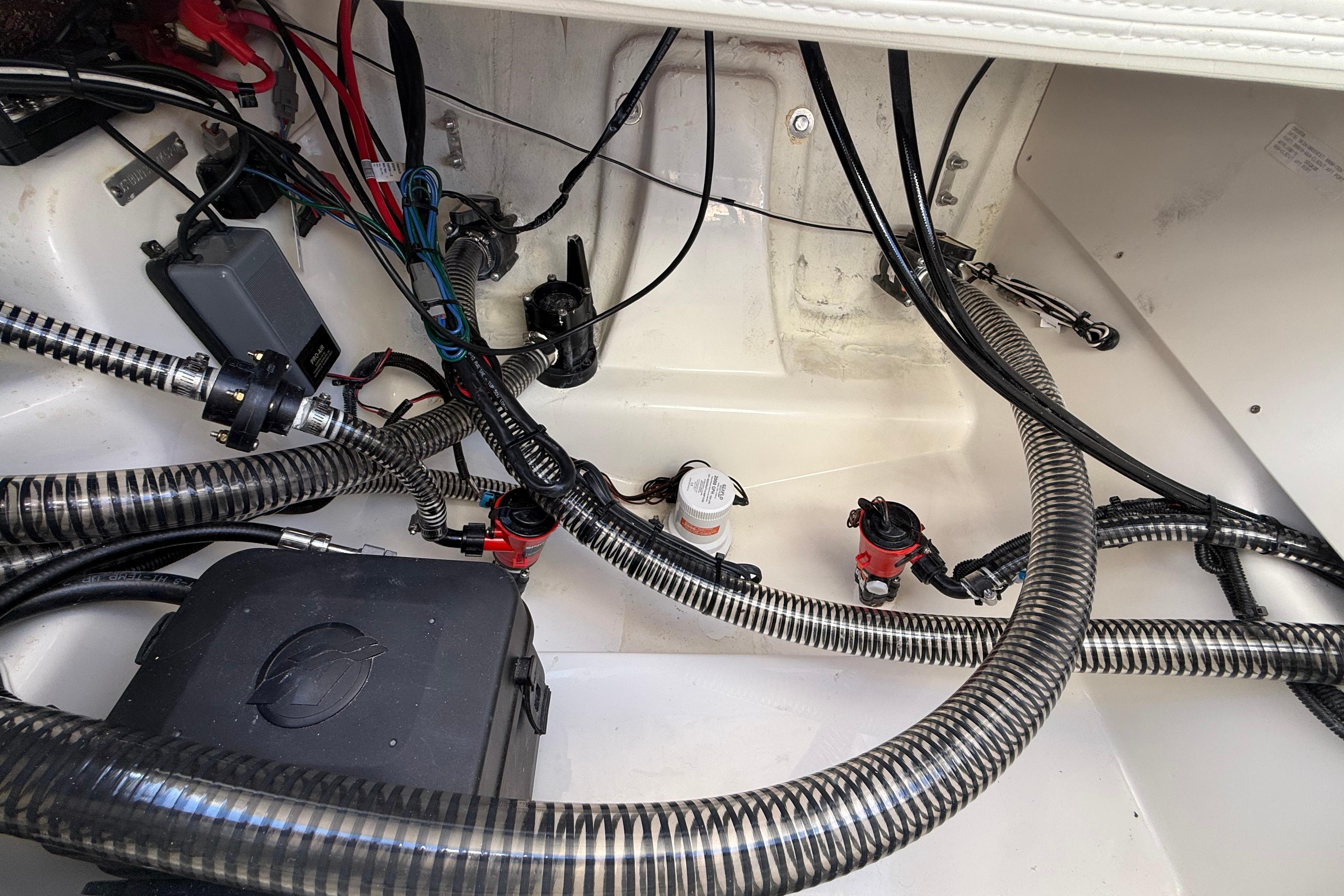 Interior wiring and components of a 2026 Mako 24 APEX boat.