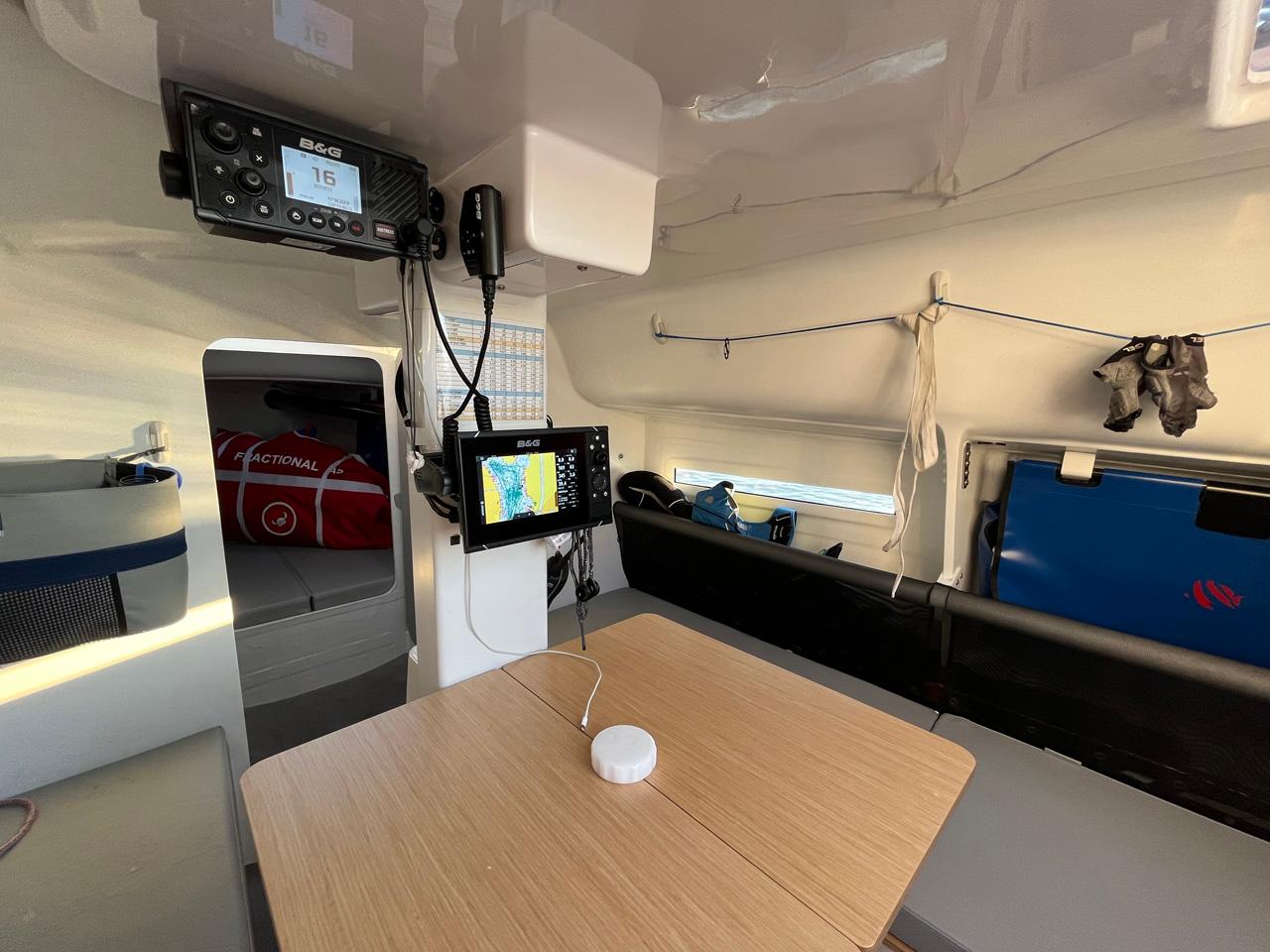 Interior of a 2018 Seascape 27 sailboat with navigation equipment and seating area.