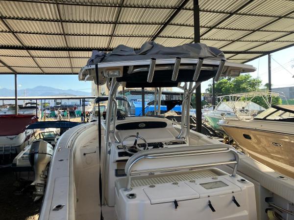 2006 Grady-White Bimini 306 boat in covered storage, surrounded by other vessels.