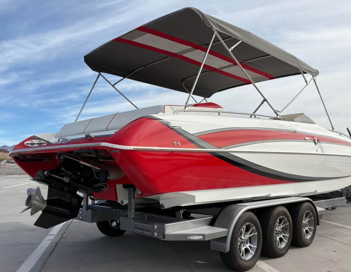 2022 Conquest 28’ Top Cat II Deck Boat with red and white design.