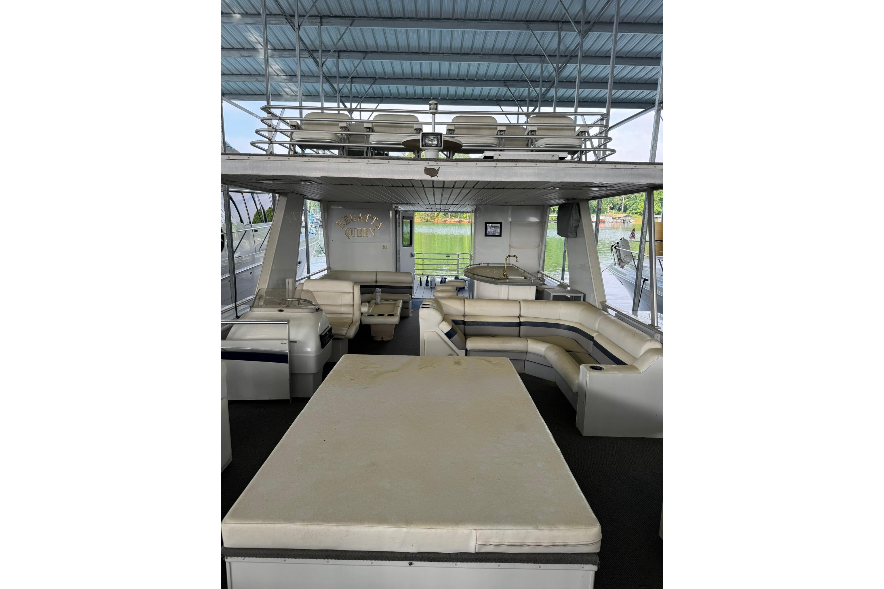 2008 Destination Yachts 45X14 interior with seating and upper deck view.