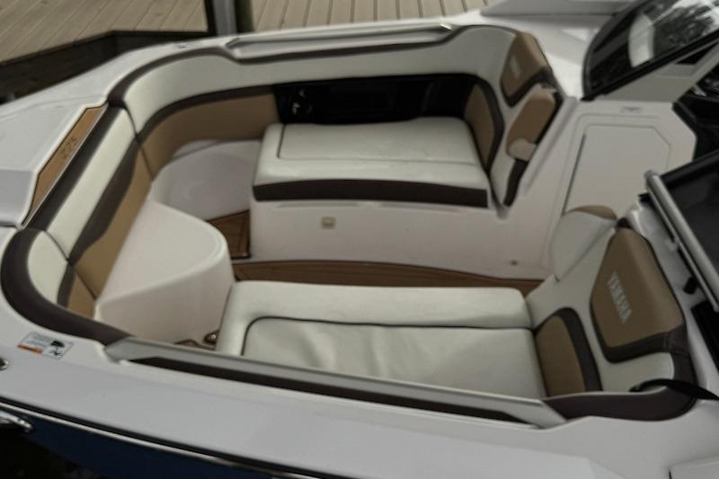 2023 Yamaha 275SDX boat interior with luxurious seating and modern design.