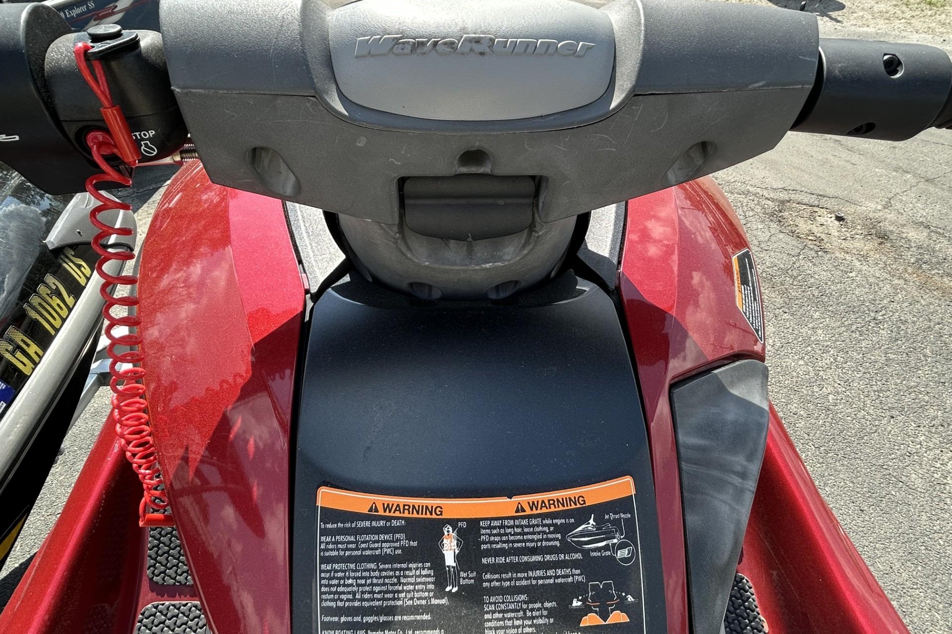 2011 Yamaha WaveRunner FZS dashboard with warning labels and red safety cord.