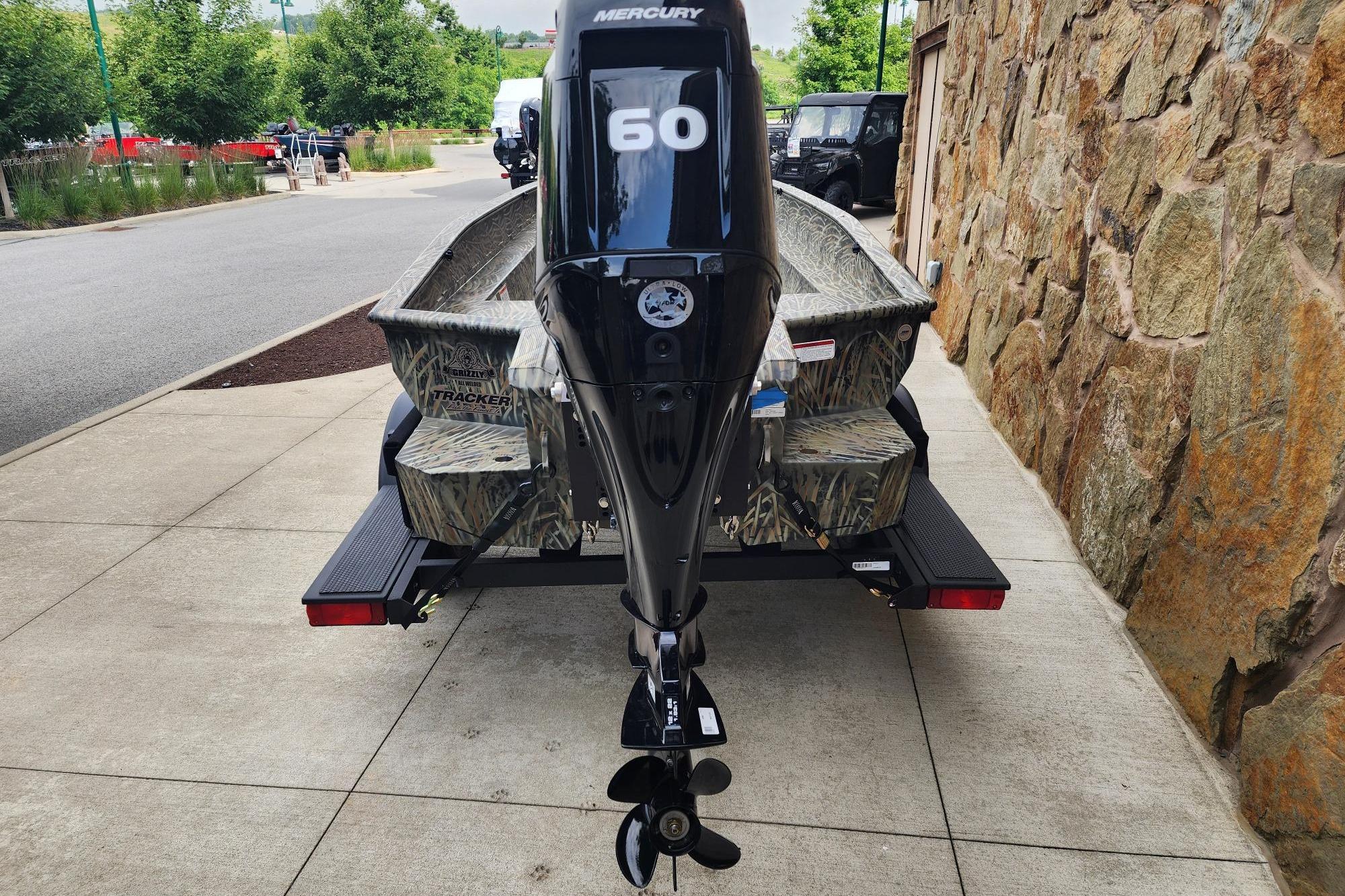 2026 Tracker Grizzly 1650 T Prairie Wings Edition boat with Mercury 60 engine.