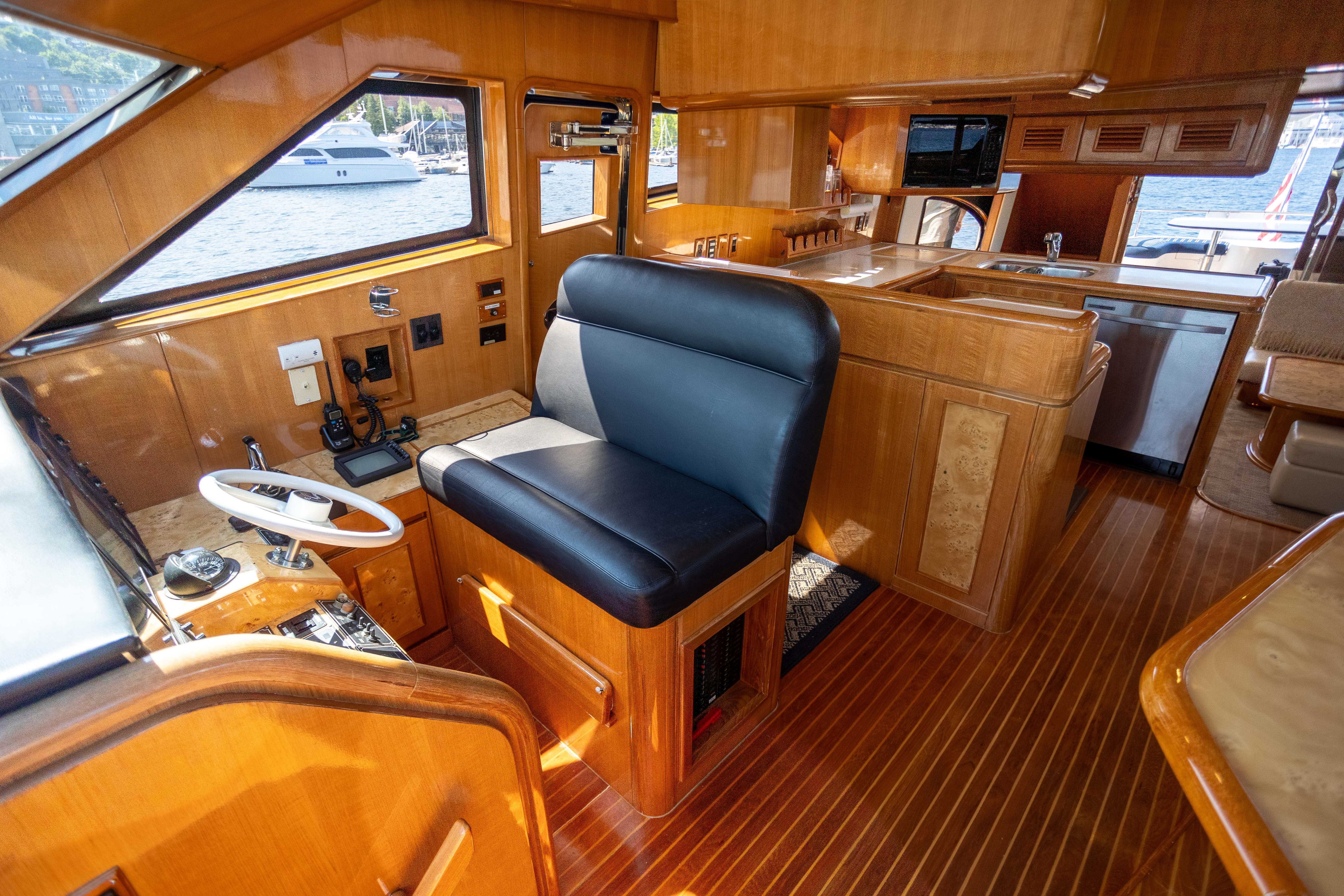 Luxurious 2001 Vitech 72 yacht interior with wood finish and modern amenities.