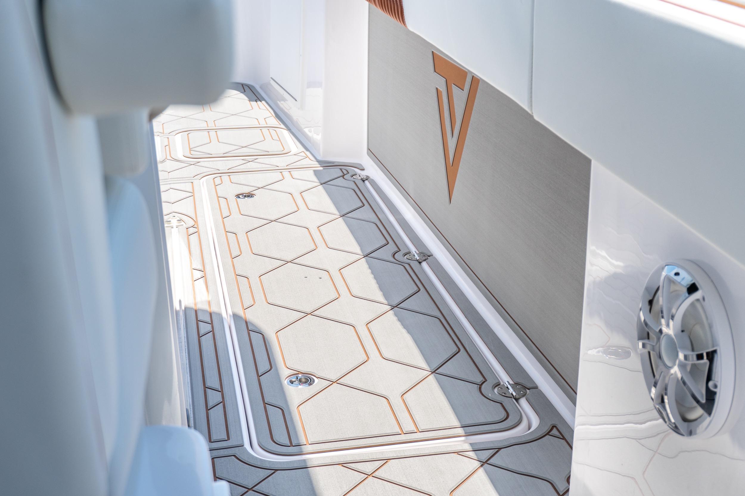2026 Twin Vee 400 GFX2 CC boat interior with sleek flooring and modern design elements.