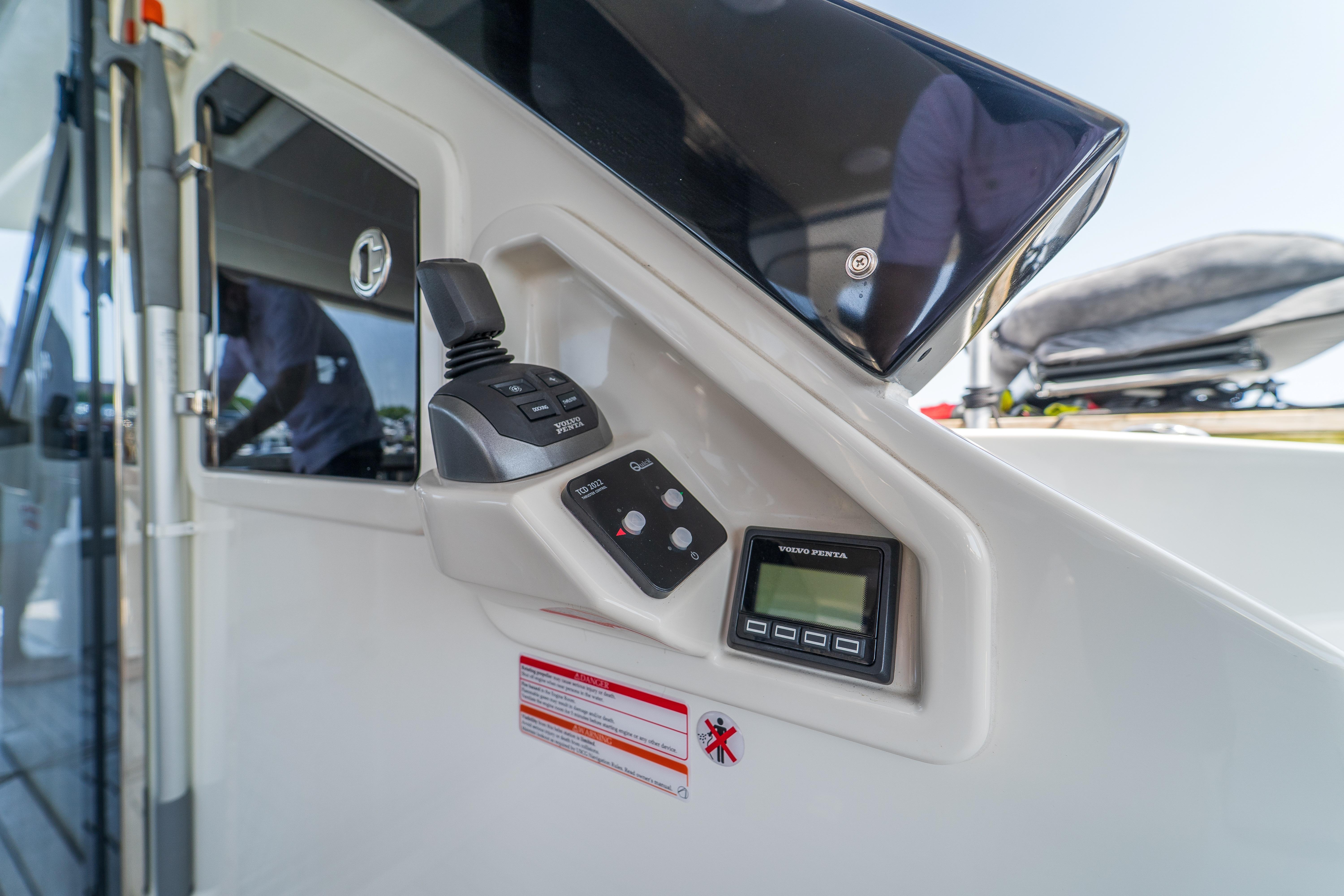 Control panel of 2023 Absolute 62 Fly yacht with joystick and display.