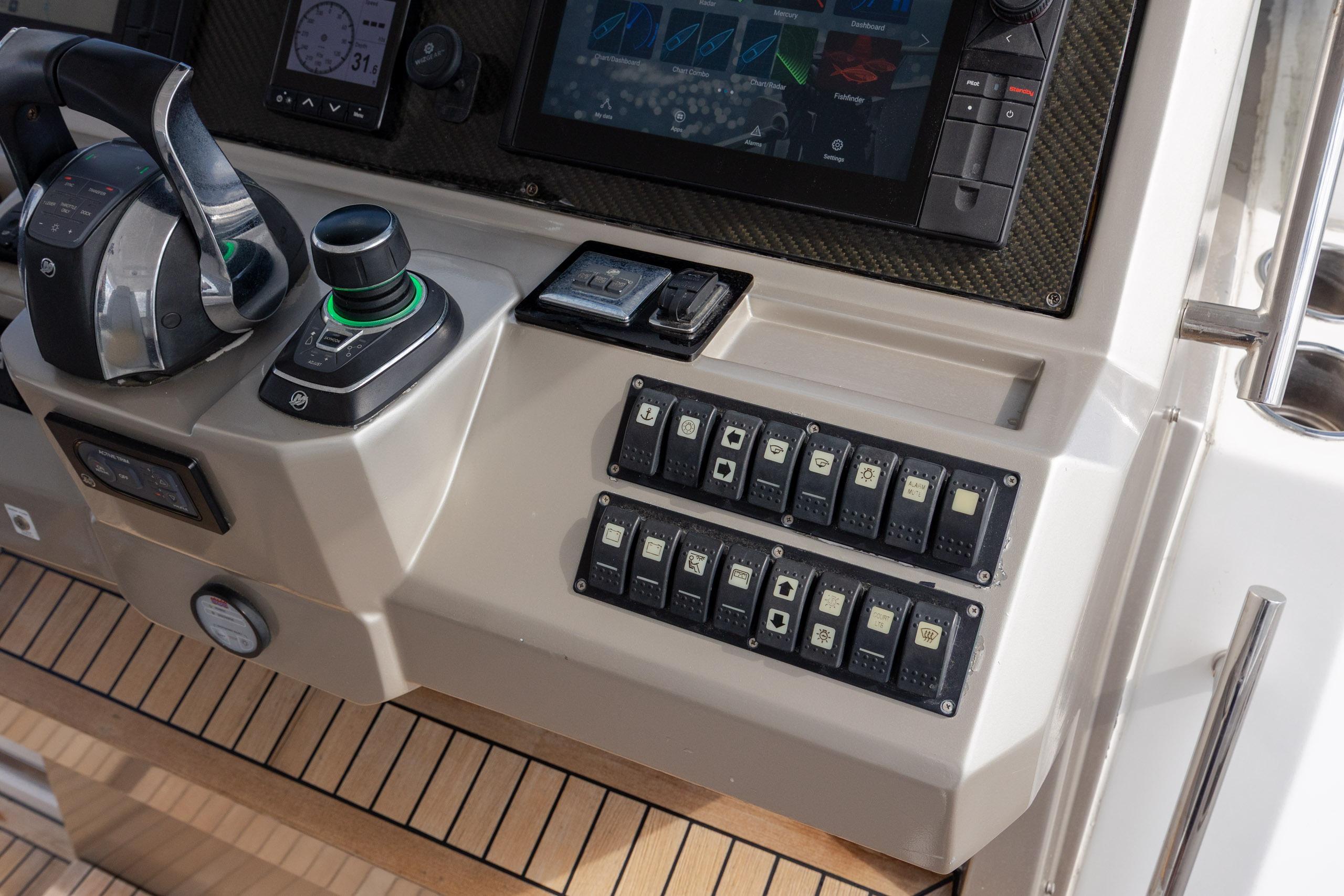 Control panel of 2019 Azimut Verve 40 yacht with switches and navigation display.