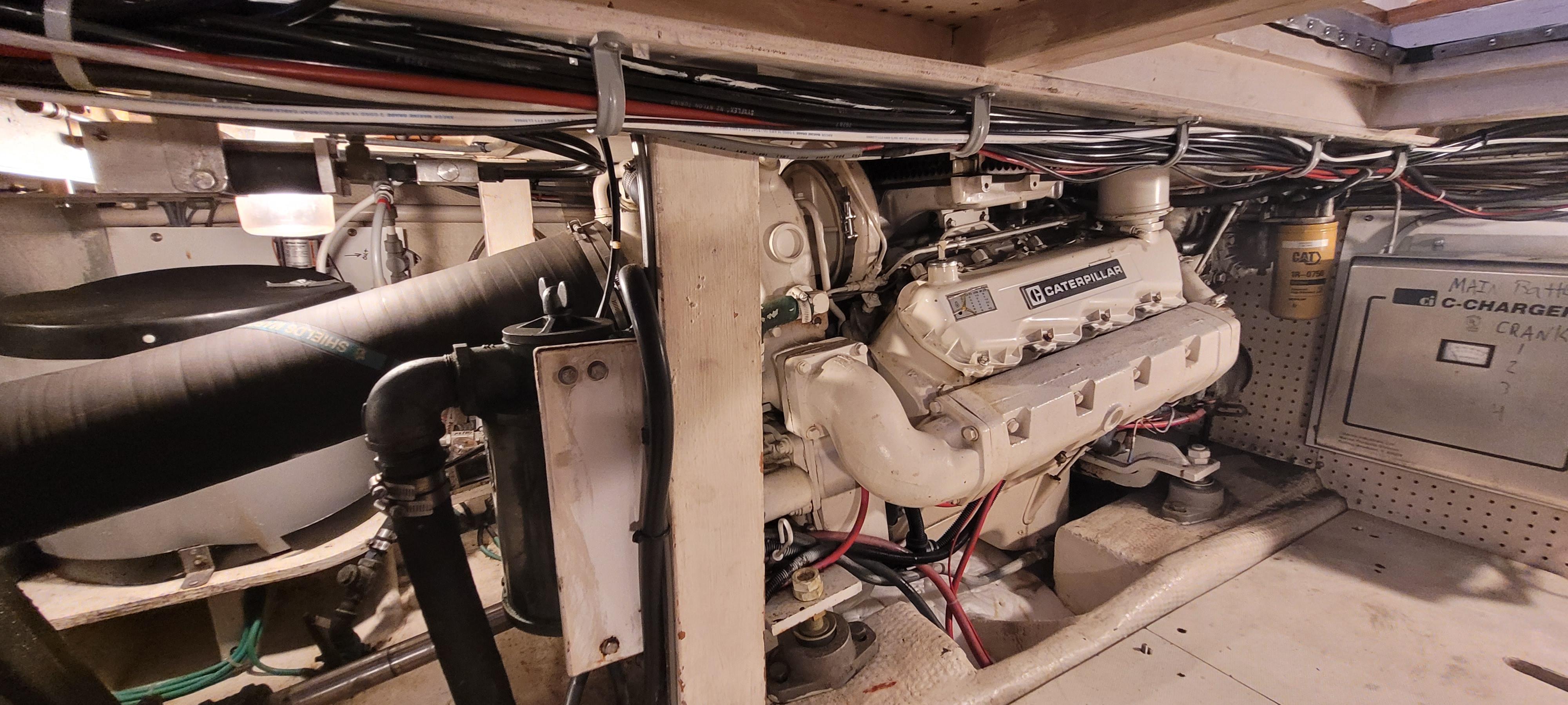 Engine room of 1989 Duffy Wilbur 42 Flybridge Cruiser with visible machinery and wiring.