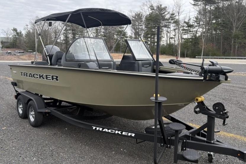 2026 Tracker Targa V-18 Combo boat on trailer, parked outdoors.