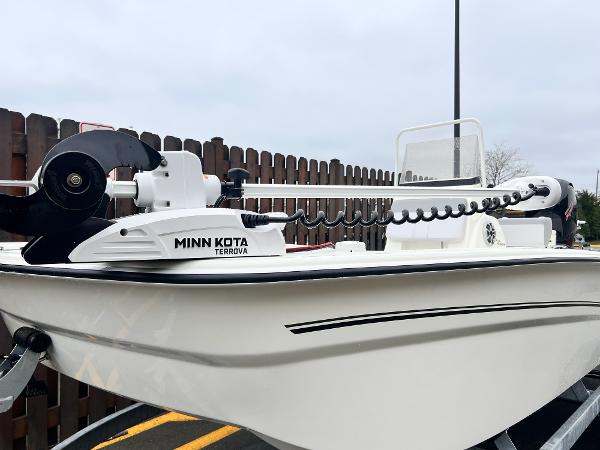 2025 Mako Pro Skiff 19 CC with Minn Kota Terrova trolling motor, parked outdoors.
