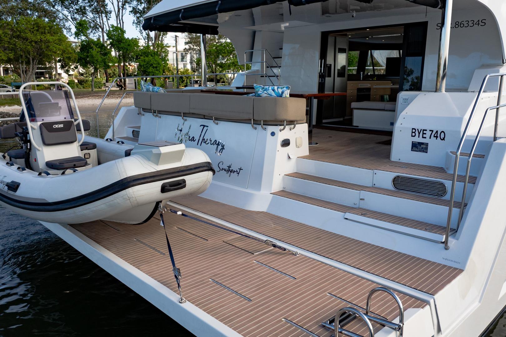 Luxury Aventura 50 yacht with tender boat, spacious deck, and modern interior, 2023 model.
