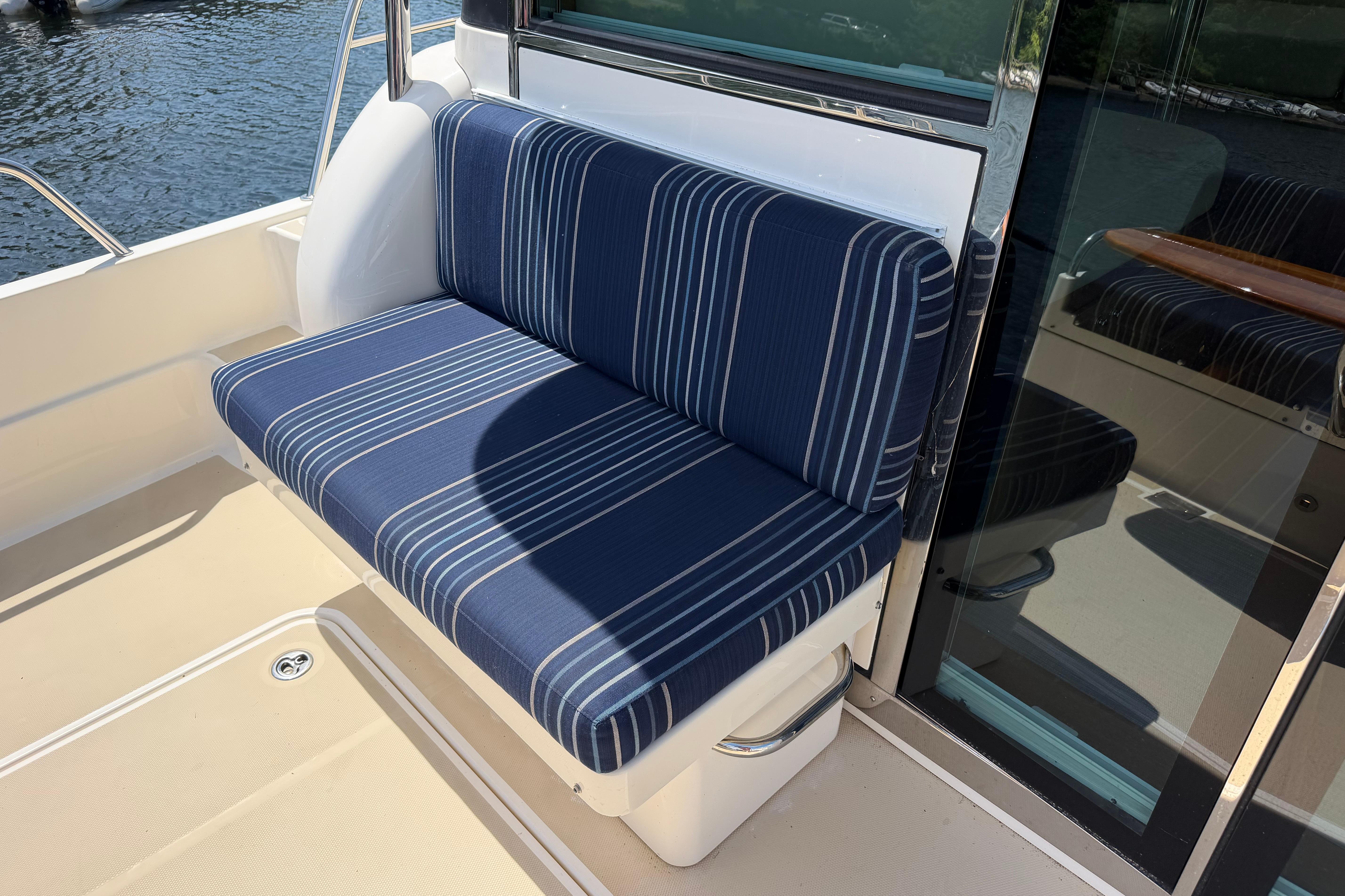 Blue striped seating on 2015 Sabre 38 Salon Express yacht deck.