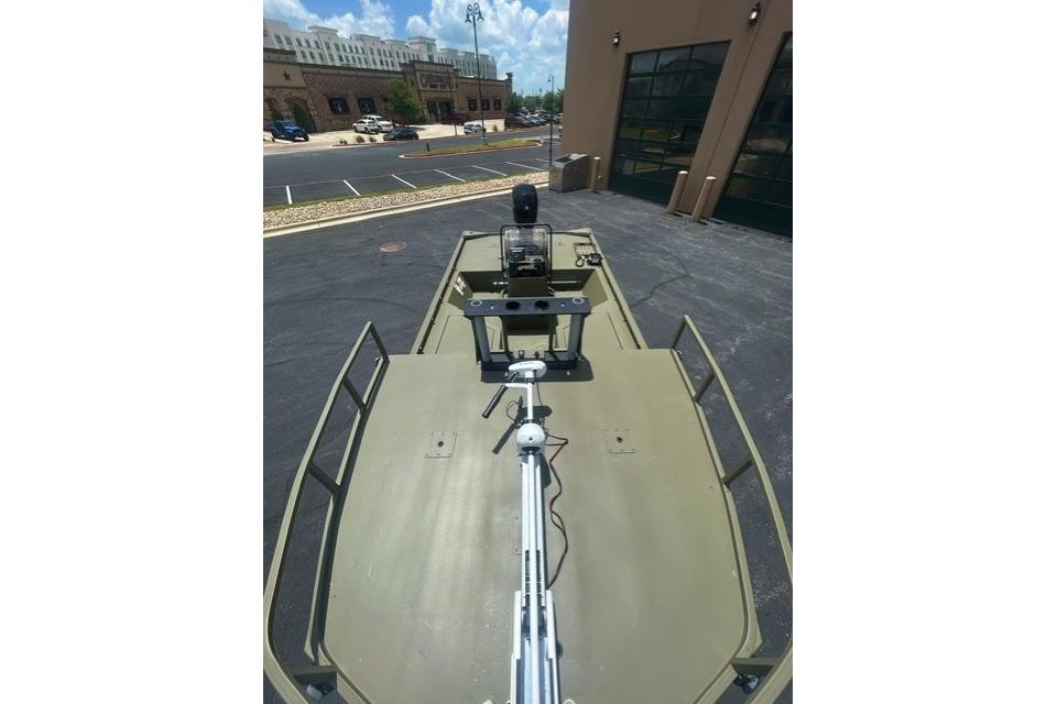2026 Tracker Grizzly 2072 CC Sportsman boat in parking lot, top view.
