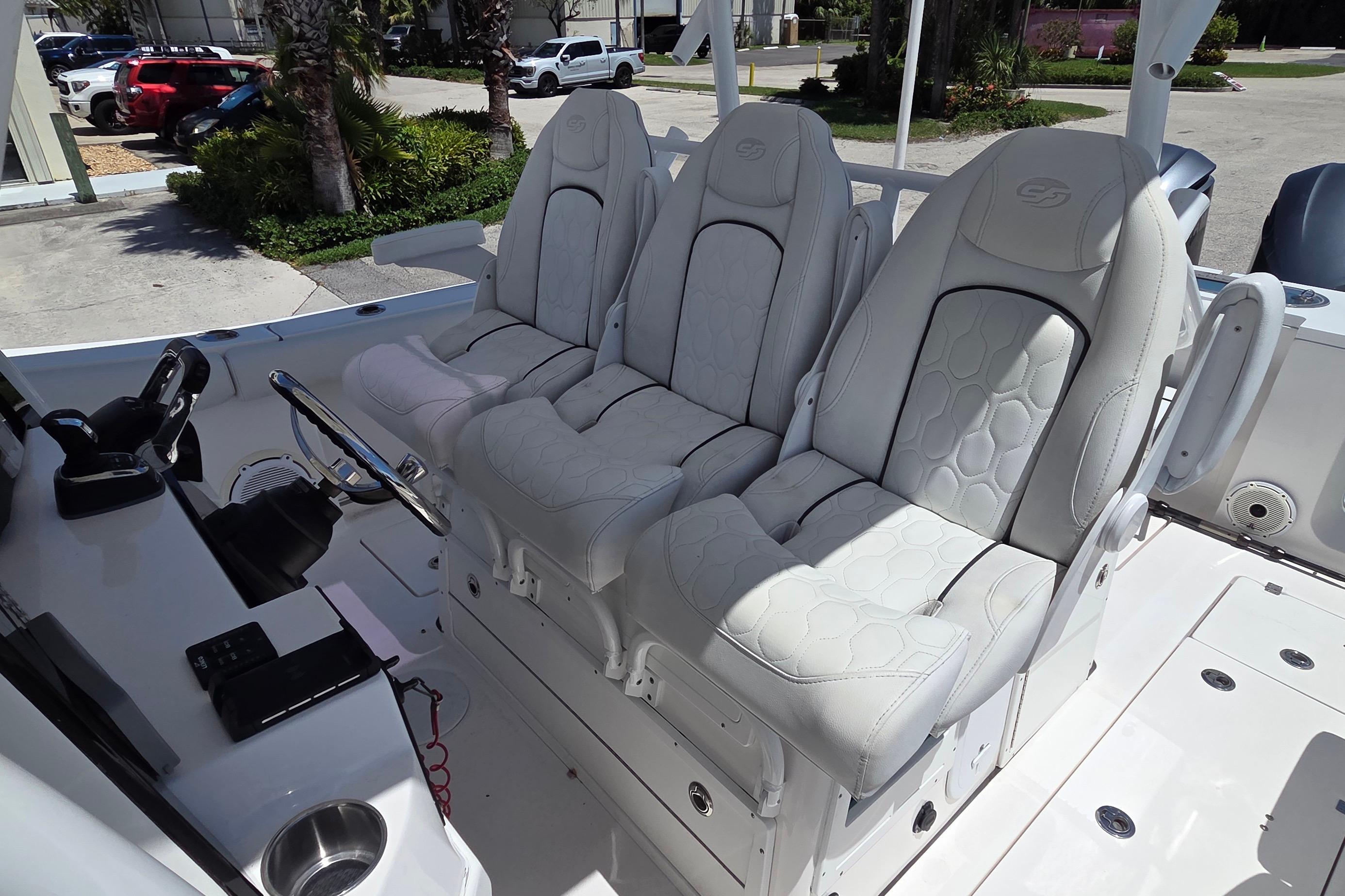2021 Sea Fox 328 Commander boat interior with luxurious white seating and modern controls.