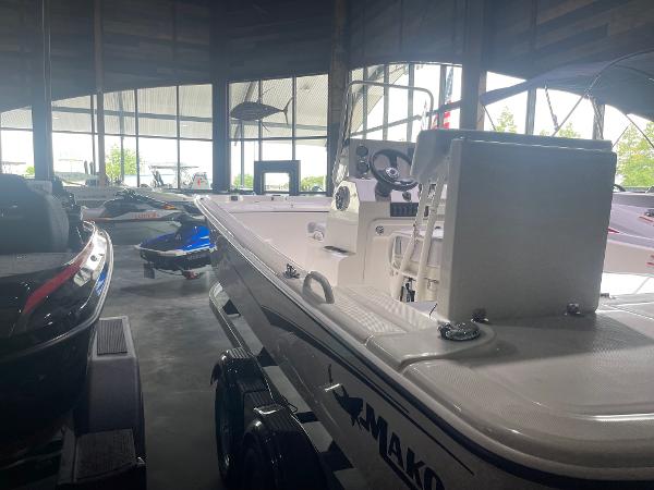 2024 Mako Pro Skiff 19 CC boat displayed in a showroom.