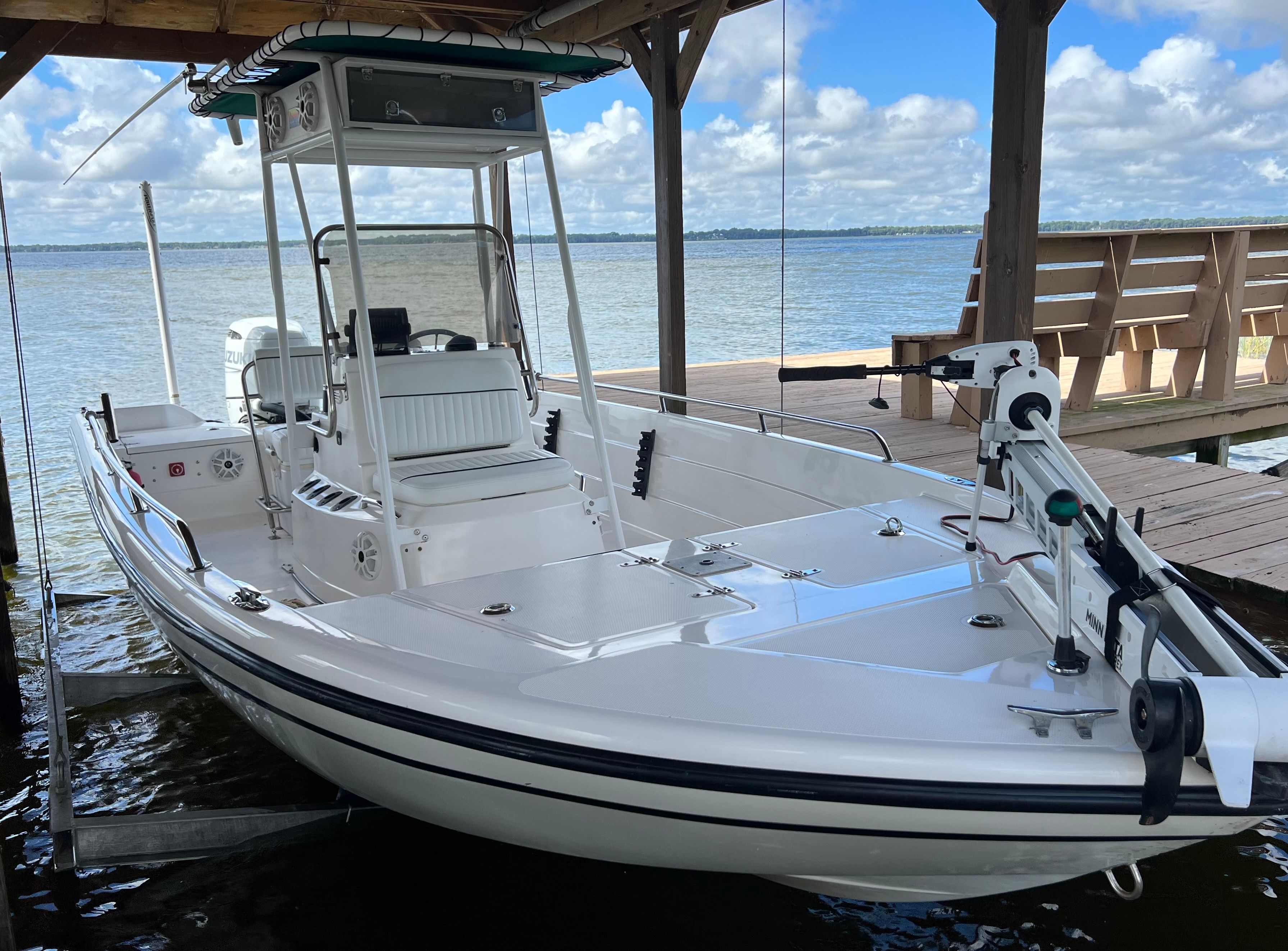 1999 Skeeter ZX2200 boat at dock with blue sky.