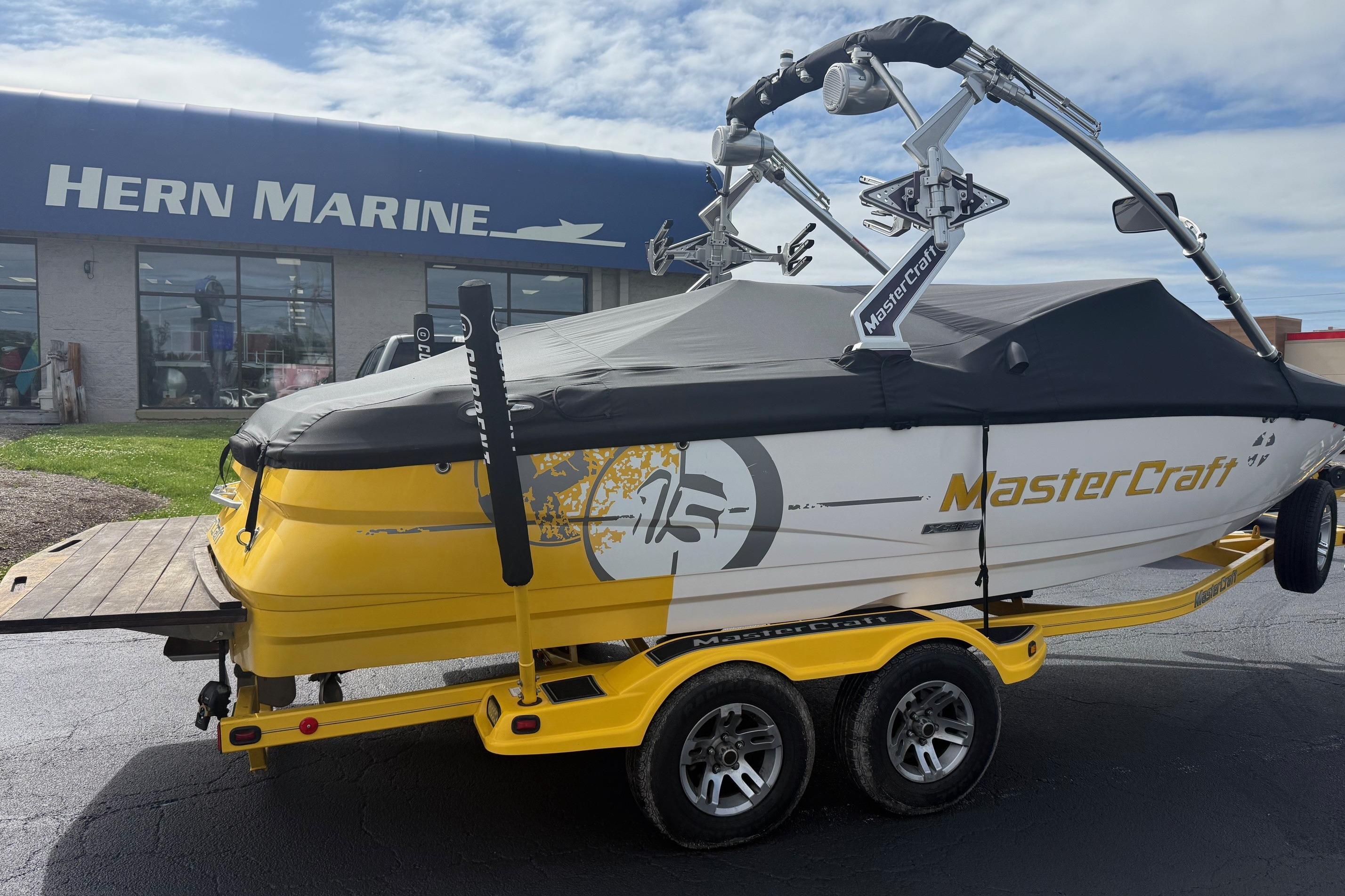 2008 MasterCraft X-15 boat on trailer outside Hern Marine dealership.