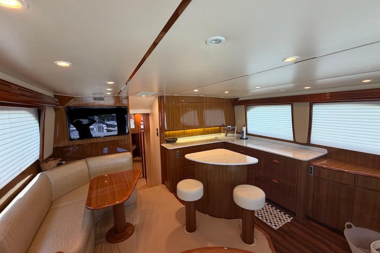 Luxurious interior of 2012 Viking 50 Convertible yacht with elegant wood finishes and modern amenities.