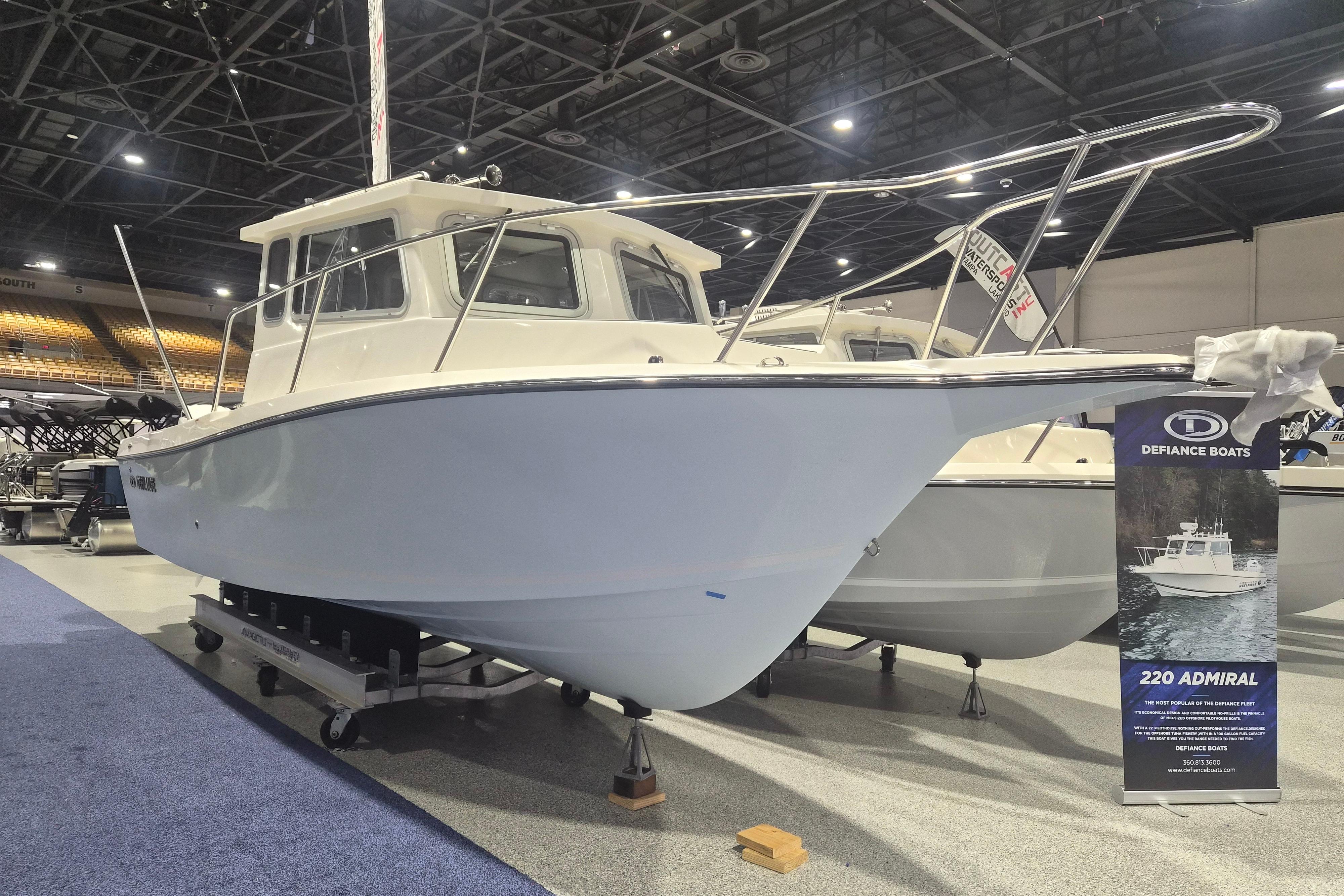 2026 Defiance Admiral 260 EX boat displayed at an indoor exhibition.