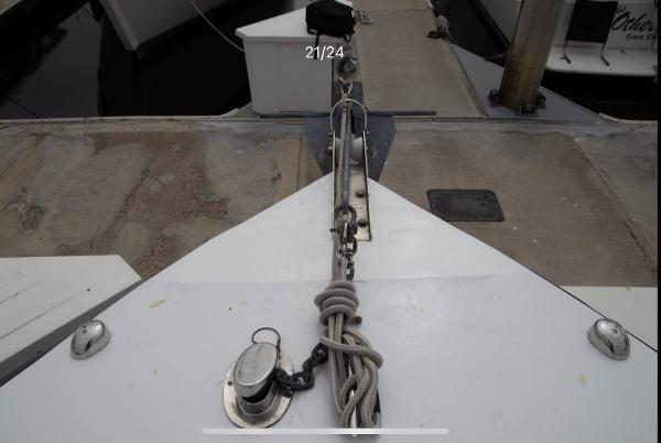 Bow of 1979 Chaparral 224 Fisherman boat docked with anchor and rope.